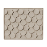 Beige ceramic tray with decorative pattern on a white background