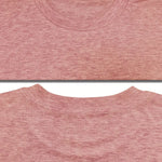 Close-up of a pink t-shirt with a visible seam on a white background