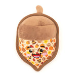 Plush acorn toy with a smiling face on a white background