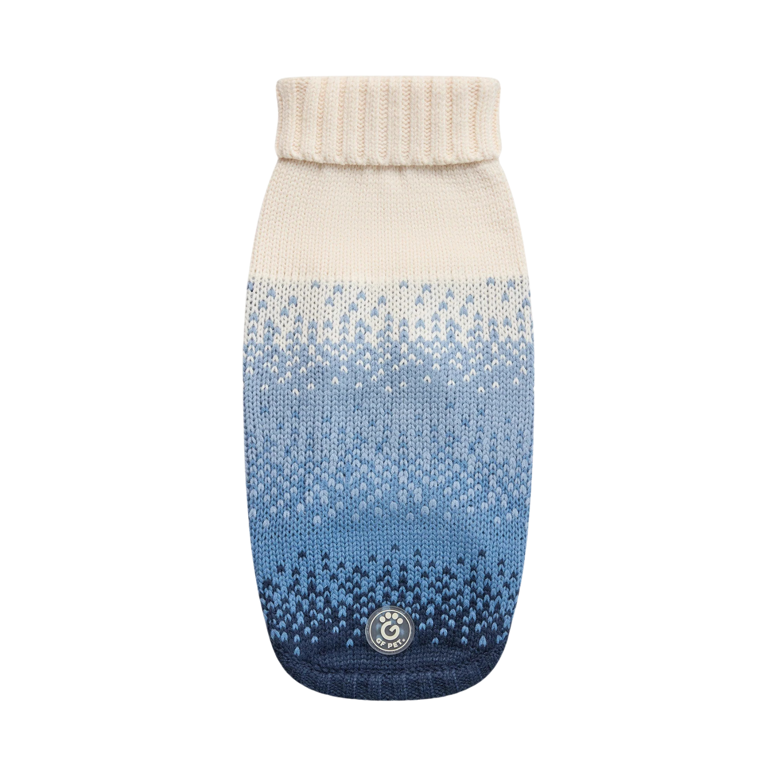 A knit pet sweater with a cream ribbed collar and a blue gradient pattern fading from cream to light blue to dark navy, featuring a circular logo patch near the bottom.