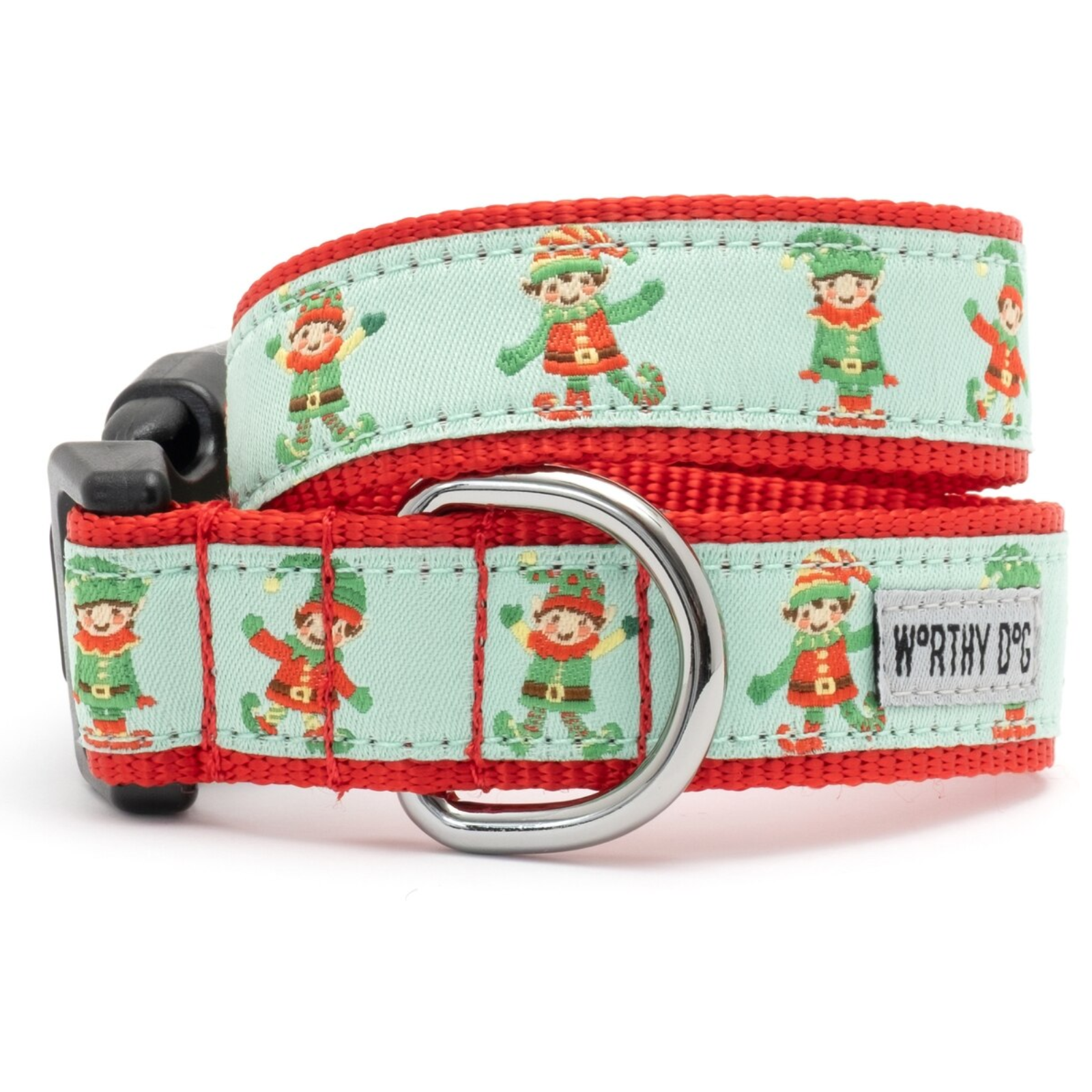 A red woven dog collar with a light mint green center panel printed with cartoon elves, featuring a silver metal D-ring and a black plastic buckle. A white brand label reading 'WORTHY DOG' is visible on the right side.