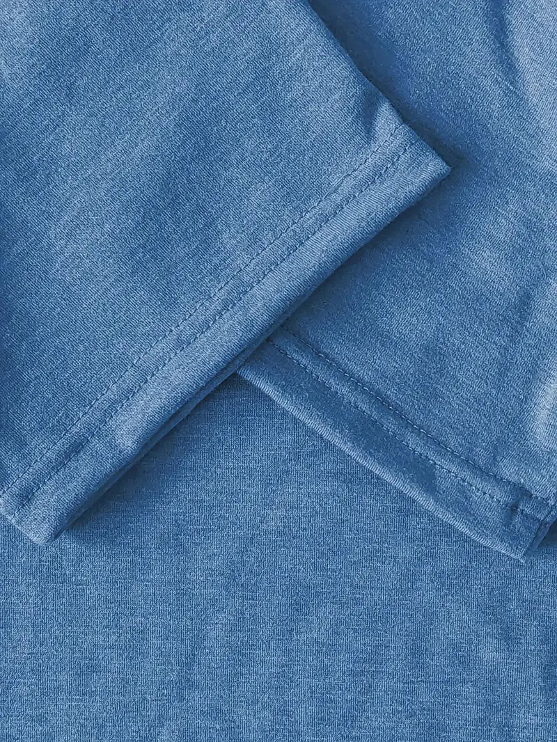 Close-up of blue fabric with a subtle pattern
