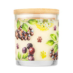 Candle with a decorative label featuring berries and paw prints on a white background