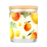 Candle with orange and leaf design on a white background