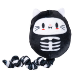 A black plush cat skeleton dog toy with white cat ears, a white cat face, and a black-and-white striped flexible tail, shown on a plain white background.