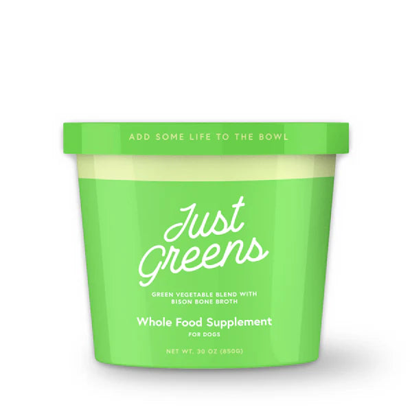Green container of 'Just Greens' whole food supplement for dogs on a white background
