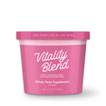 Pink container of 'Vitality Blend' whole food supplement for dogs on a white background
