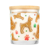 Candle with gingerbread dog pattern on a white background