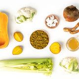 Assorted vegetables and ingredients on a white background