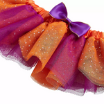 Colorful tutu with purple and orange ribbons on a white background