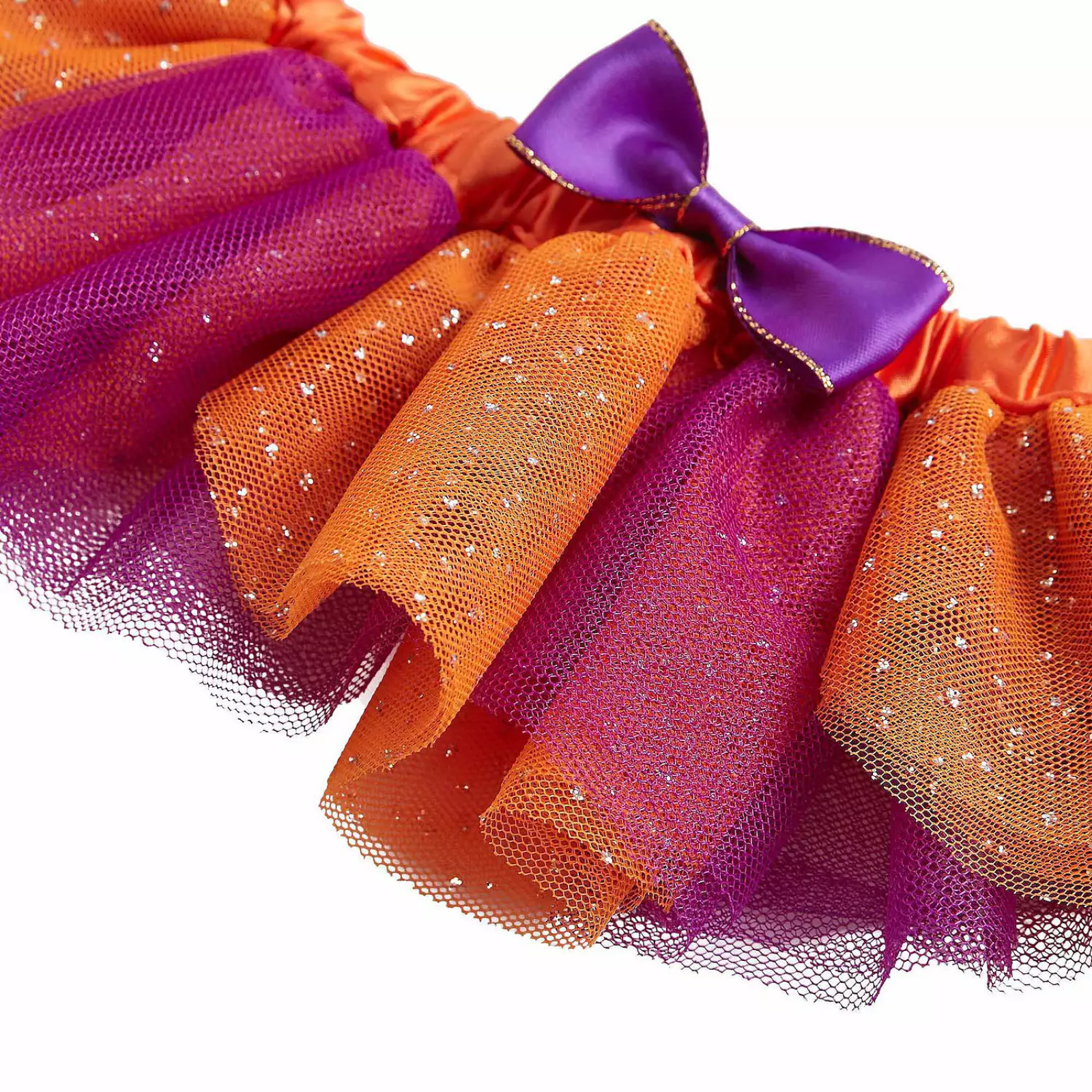 Colorful tutu with purple and orange ribbons on a white background