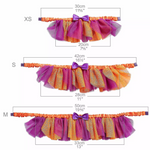 Measurement chart of a colorful tutu skirt with size labels and dimensions.
