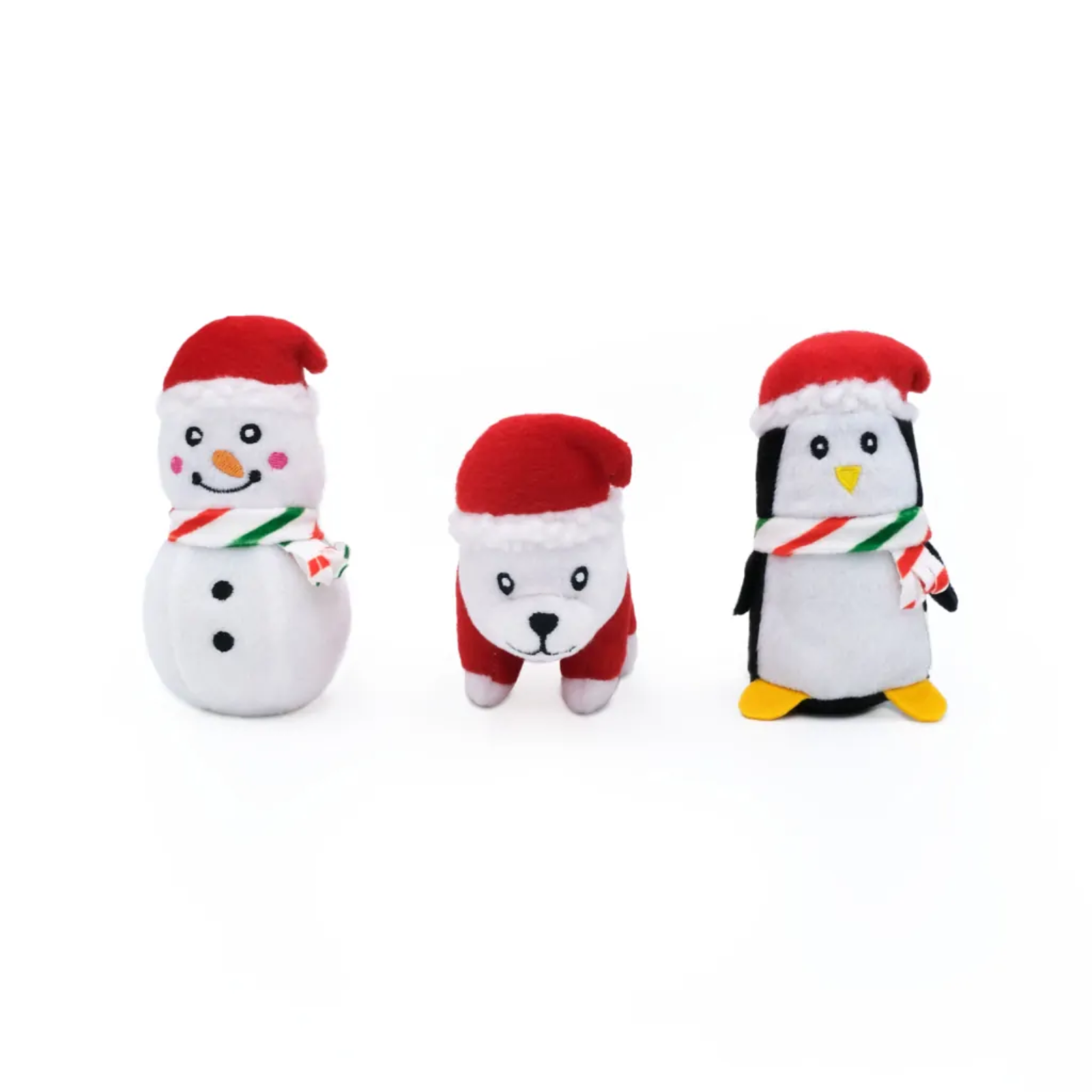 Three plush toys resembling a snowman, dog, and penguin on a white background