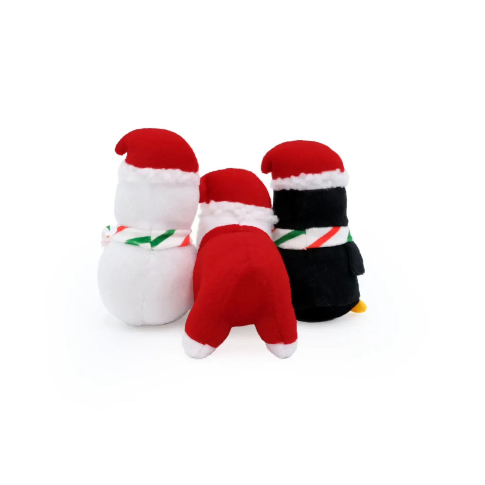 Three plush toys shaped like penguins in red, white, and black outfits on a white background