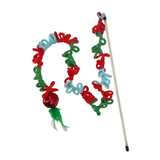 Colorful cat toy with a bell and wand on a white background