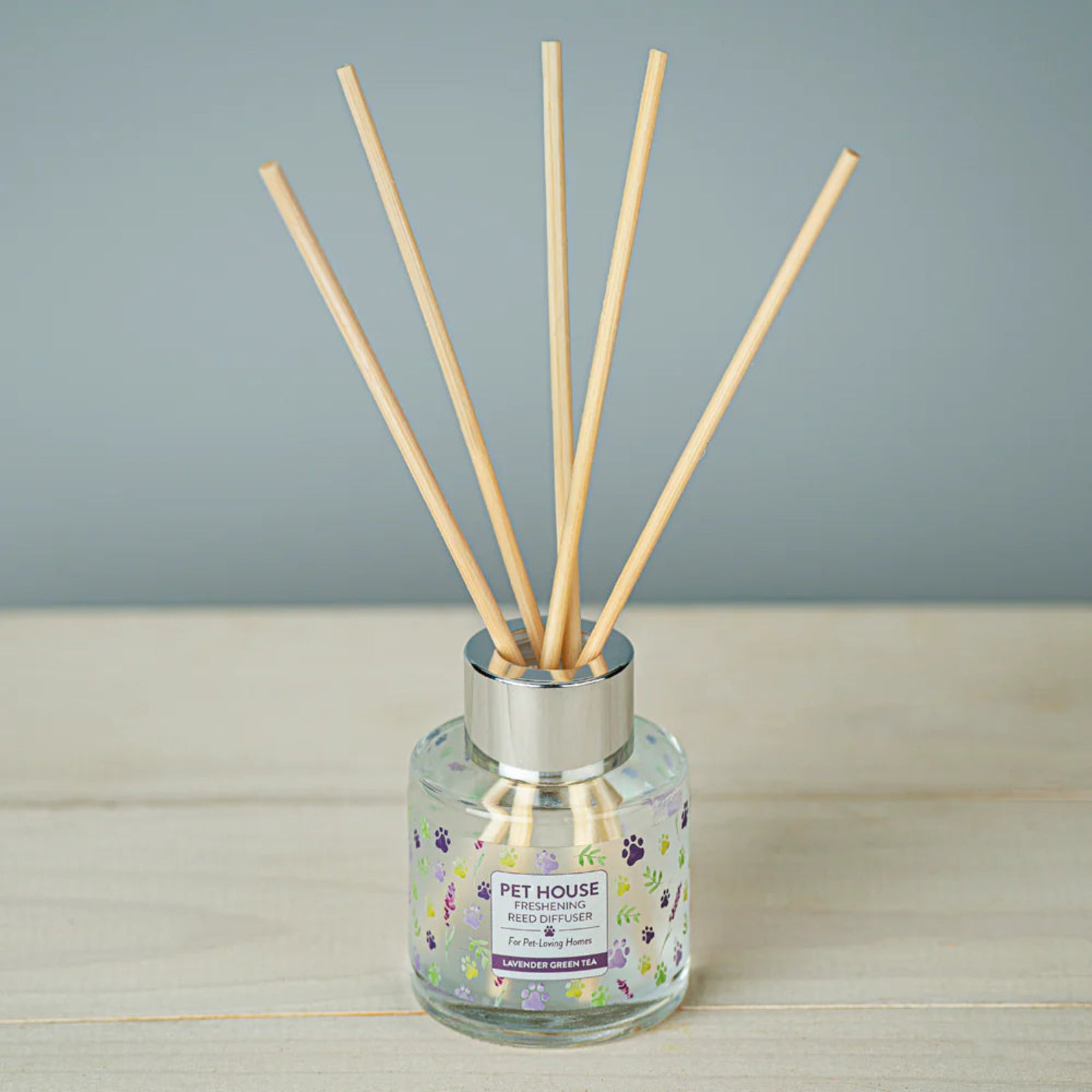 Diffuser with wooden sticks on a gray background