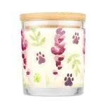 Candle with paw print and leaf pattern on a white background