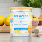 Pet House Candle labeled 'Lemon Cupcake' on a kitchen counter with lemons and baking items.