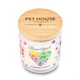 Pet House Candle with colorful paw print heart design on a white background