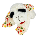 A plush sheep toy with a white fluffy body, black embroidered eyes and nose, and cream-colored ears and feet decorated with colorful autumn leaf patterns in red, orange, green, and brown.