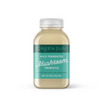 Bottle of Green Juju wild fermented mushroom probiotic on a white background