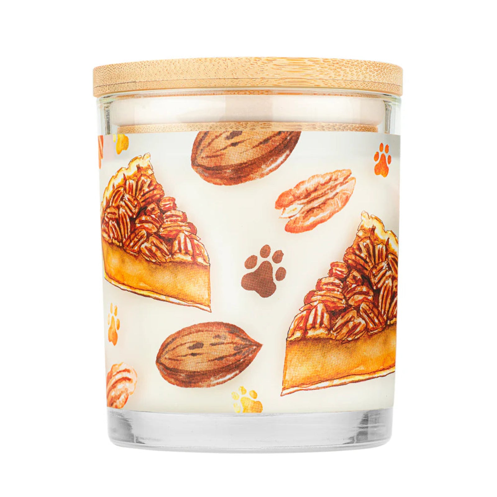 Candle with a design of pecan pie slices and nuts on a white background