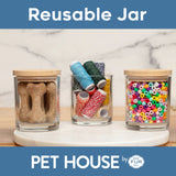 Three glass jars with wooden lids containing dog treats, thread spools, and beads on a marble surface with 'PET HOUSE by FUR' branding.
