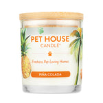 Pet Candle with tropical design featuring palm trees, pineapples, and paw prints on a white background.