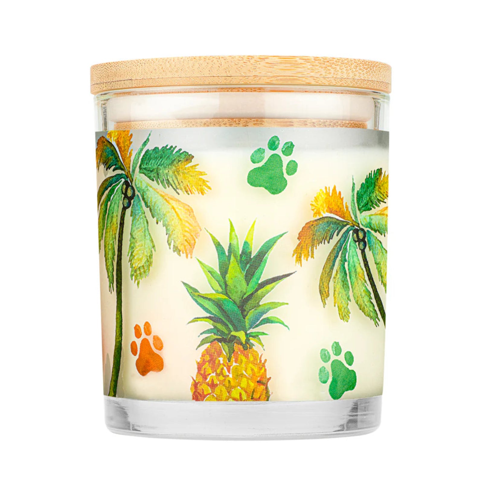 Candle with tropical design featuring palm trees, pineapples, and paw prints on a white background.