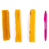 Set of yellow hair clips and a pink comb on a white background