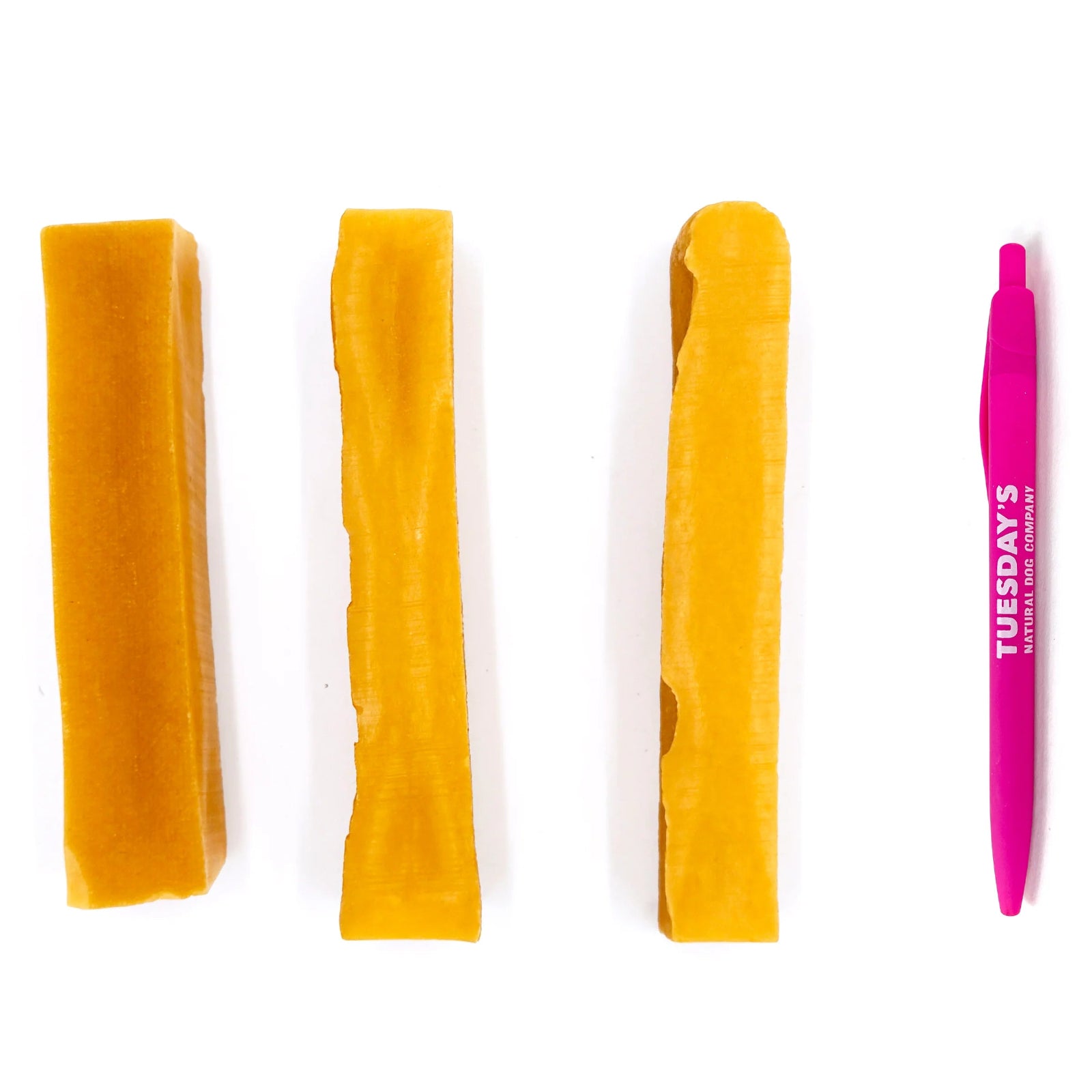Set of yellow hair clips and a pink comb on a white background