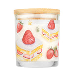 Candle with strawberry and cake design on a white background