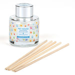 Pet House reed diffuser with wooden sticks on a white background