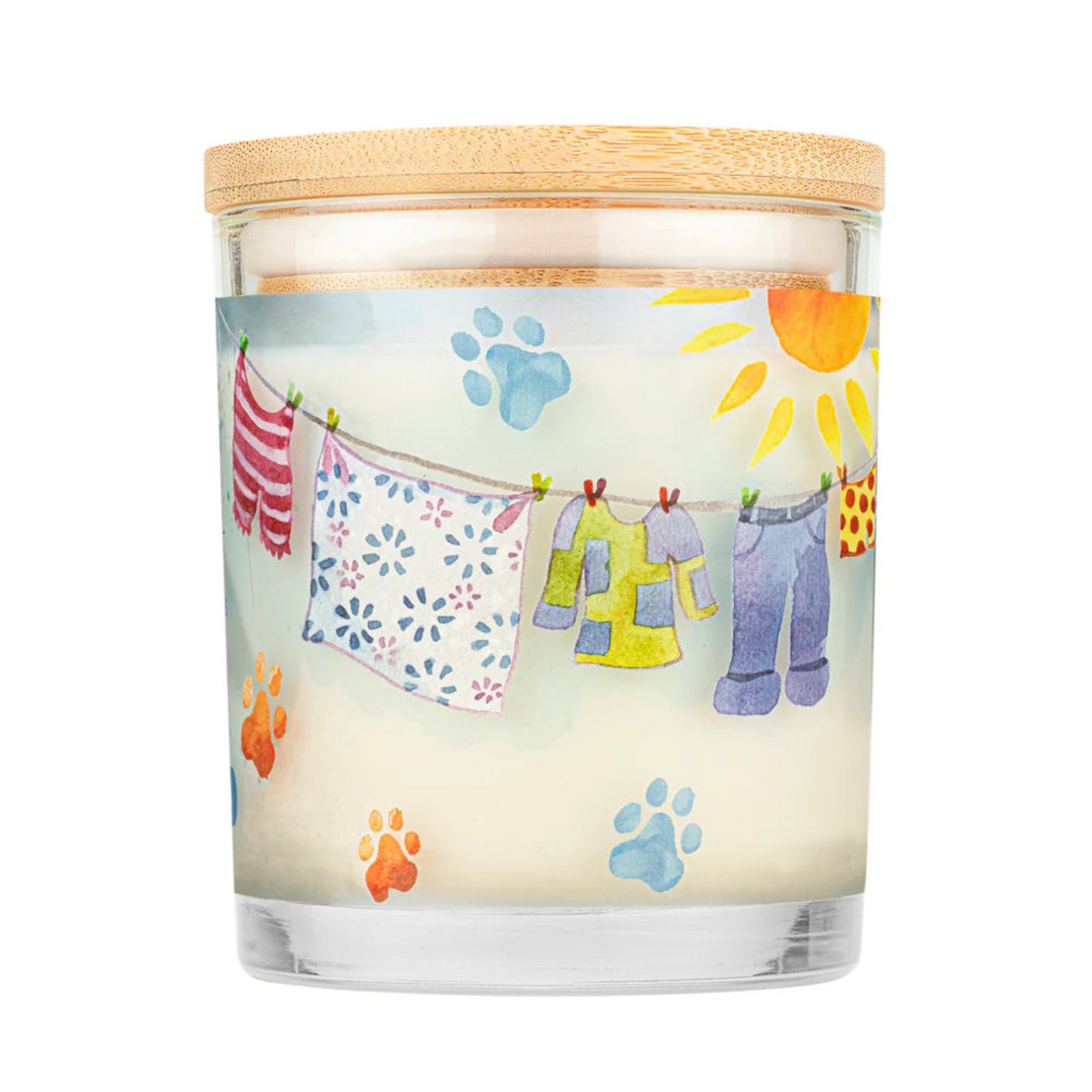 Candle with a design of clothes on a line and paw prints on a white background