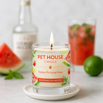 Pet House Candle with watermelon and mojito design on a table with watermelon and lime.
