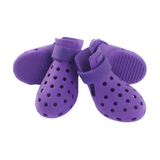 Purple pet shoes with velcro straps on a white background