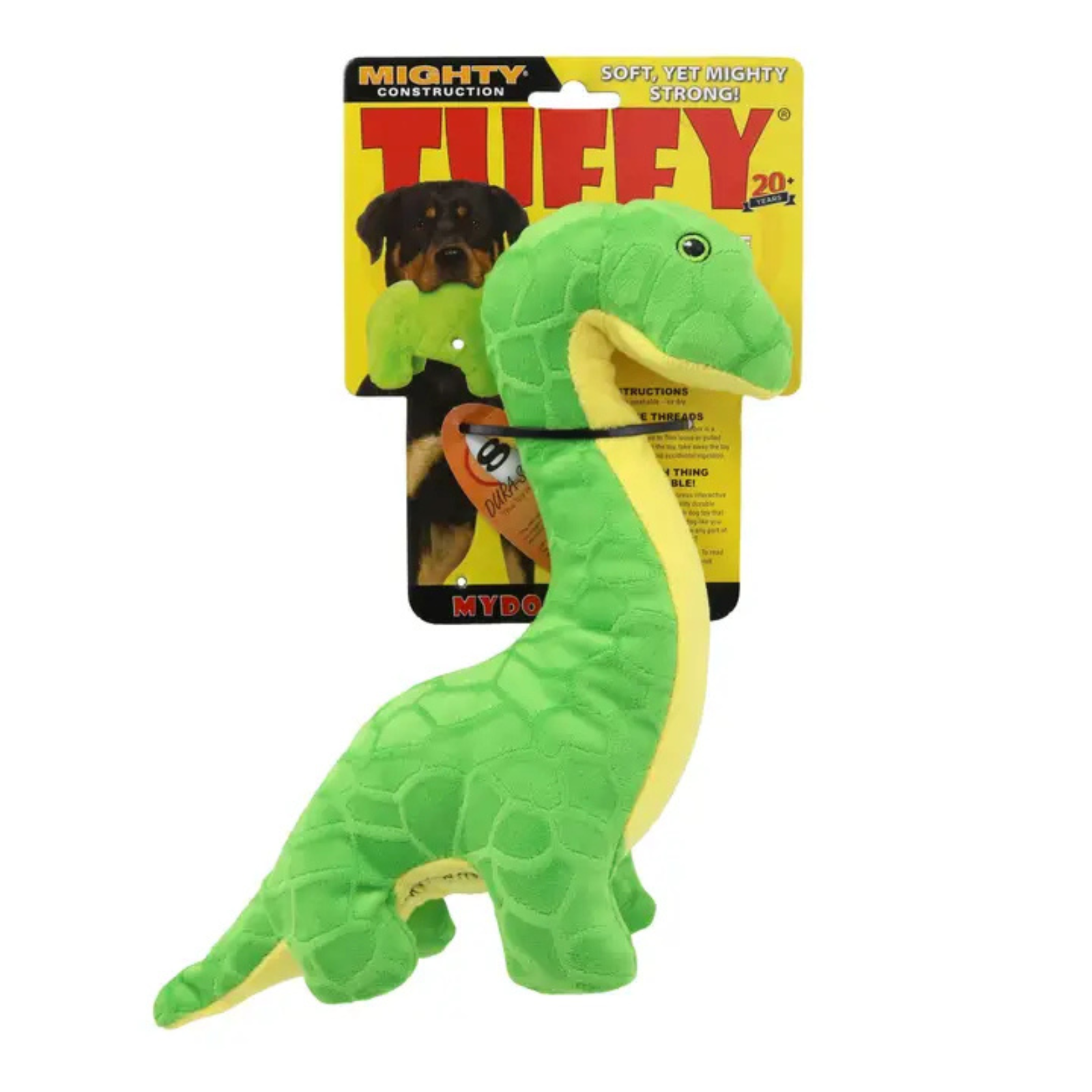 A green plush dinosaur dog toy with a yellow underside and black collar, shown in front of its yellow retail packaging card. The packaging features the brand name 'Mighty Construction' and the product name 'Tuffy'.