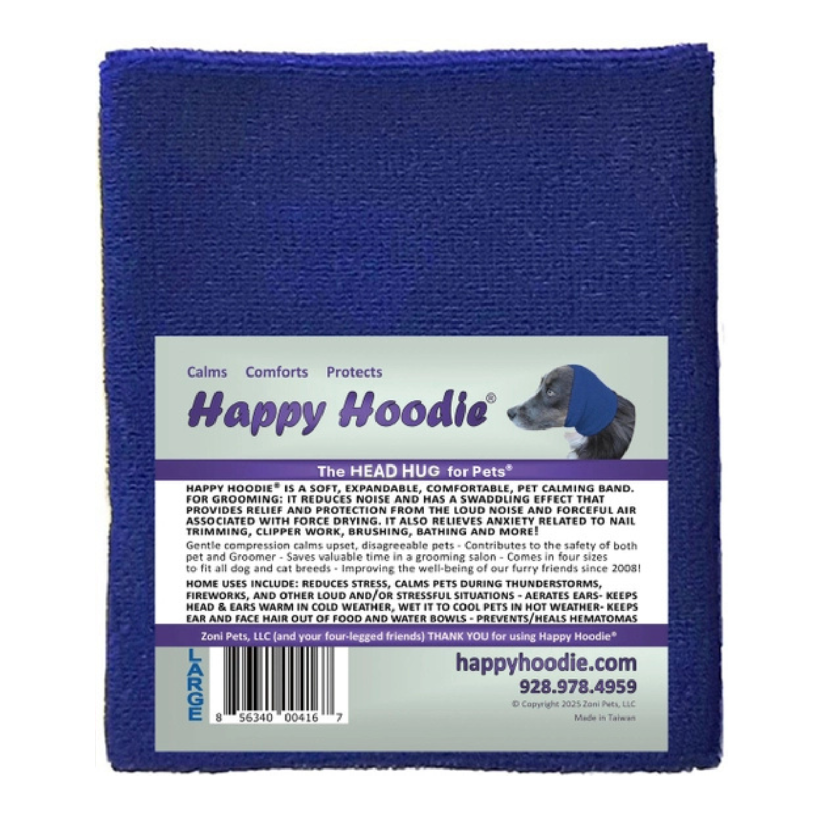 A blue textured pet calming band wrap with a white paper label that reads 'Happy Hoodle' and shows a dog photo, photographed against a plain white background.