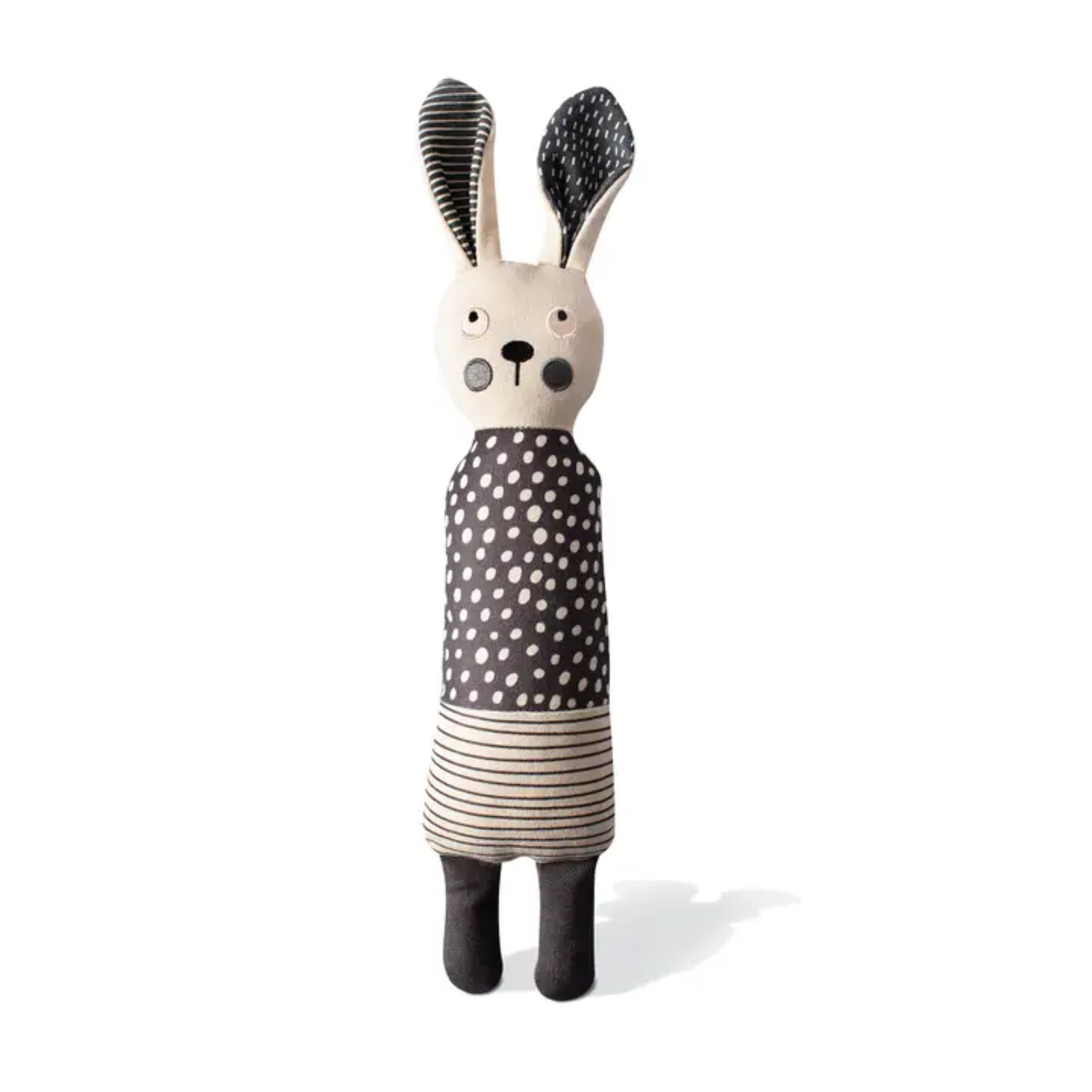 Toy rabbit with a polka dot dress on a white background