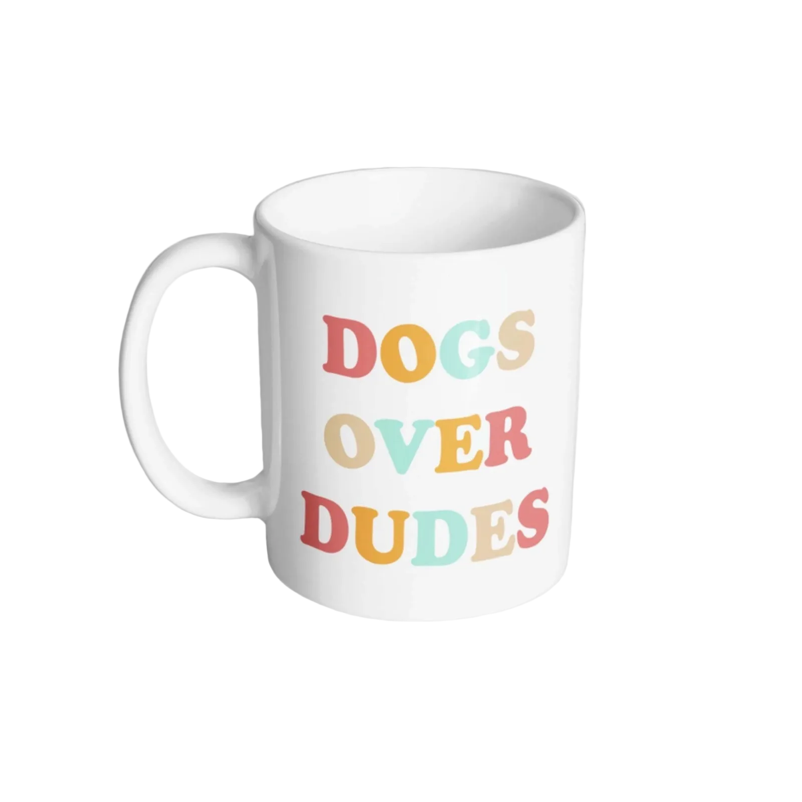 A white ceramic coffee mug with the text 'DOGS OVER DUDES' printed on the side in a playful, multicolored font featuring shades of red, orange, yellow, and light blue, set against a light gray background.