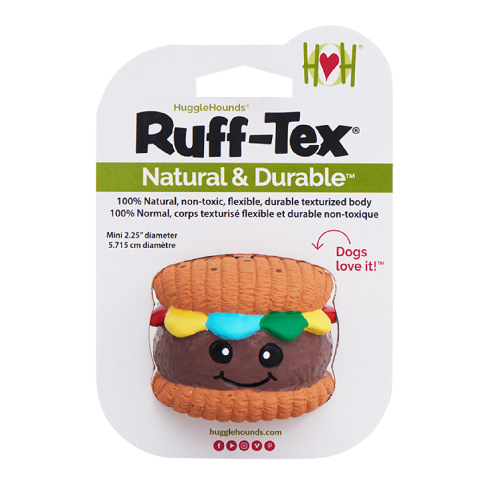 HuggleHounds Ruff-Tex dog toy in its original retail blister packaging. The toy is a textured, flexible hamburger-shaped dog toy with a brown patty, orange bun, yellow and green cheese, and a blue beefsteak layer, featuring a cute black and white face.