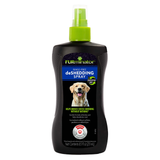 A bottle of Furminator Rinse Free Shedding Spray for dogs, featuring a black bottle with a bright green spray nozzle and a label showing a yellow Labrador retriever.
