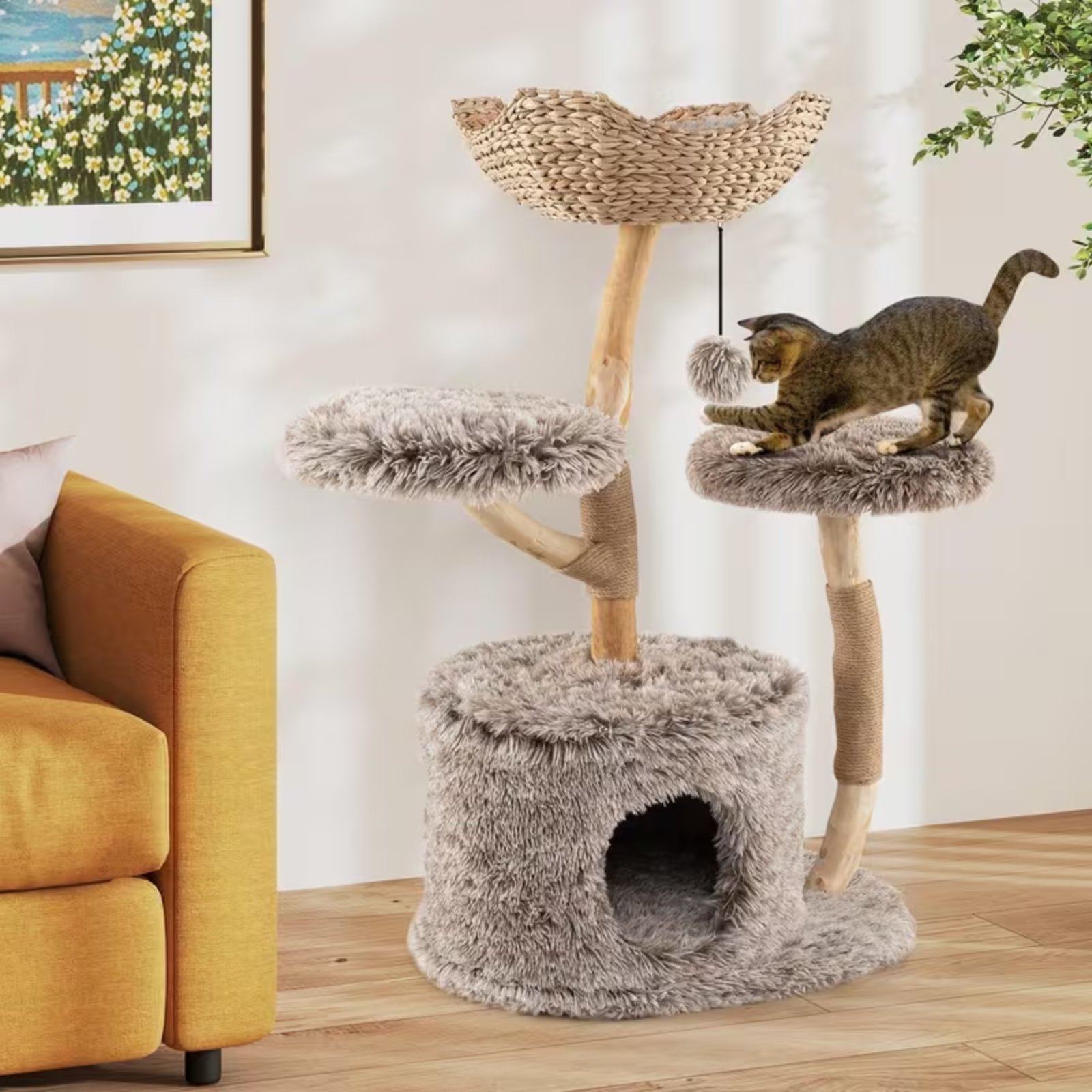 Cat tree with multiple levels and a cat sitting on one of the platforms in a living room setting.