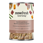 A can of Now Fresh Good Gravy Beef & Lamb Recipe dog food on a plain white background. The can features a cream-colored label with illustrations of beef, lamb, green beans, and carrots, a dusty pink band with the product name in English and French, and a clear bottom window showing the wet food inside.