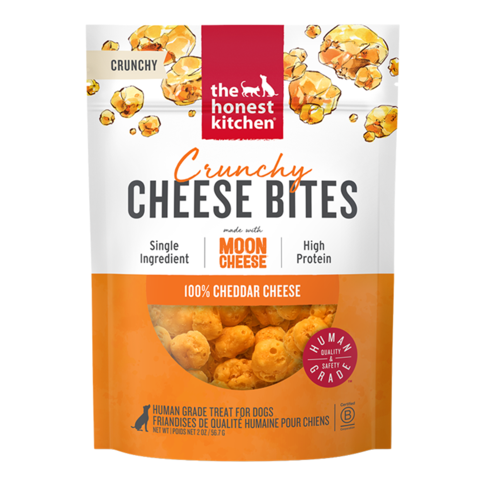 A stand-up pouch of The Honest Kitchen Crunchy Cheese Bites dog treats, featuring Moon Cheese flavor. The packaging is white and orange with illustrations of cheese pieces, and a clear window near the bottom shows the golden-brown cheese-baked treats inside.