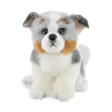 A plush toy dog with fluffy white, gray, and tan fur, sitting against a plain white background.