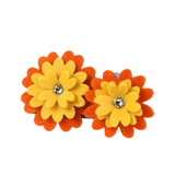Two felt flower hair clips with orange outer petals, yellow inner petals, and a small clear rhinestone in the center, shown on a plain white background.