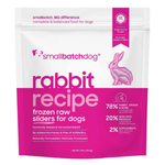 A 3 lb stand-up pouch of Small Batch Dog 'Rabbit Recipe' frozen raw sliders for dogs, featuring a white and bright pink design with a pink rabbit illustration.