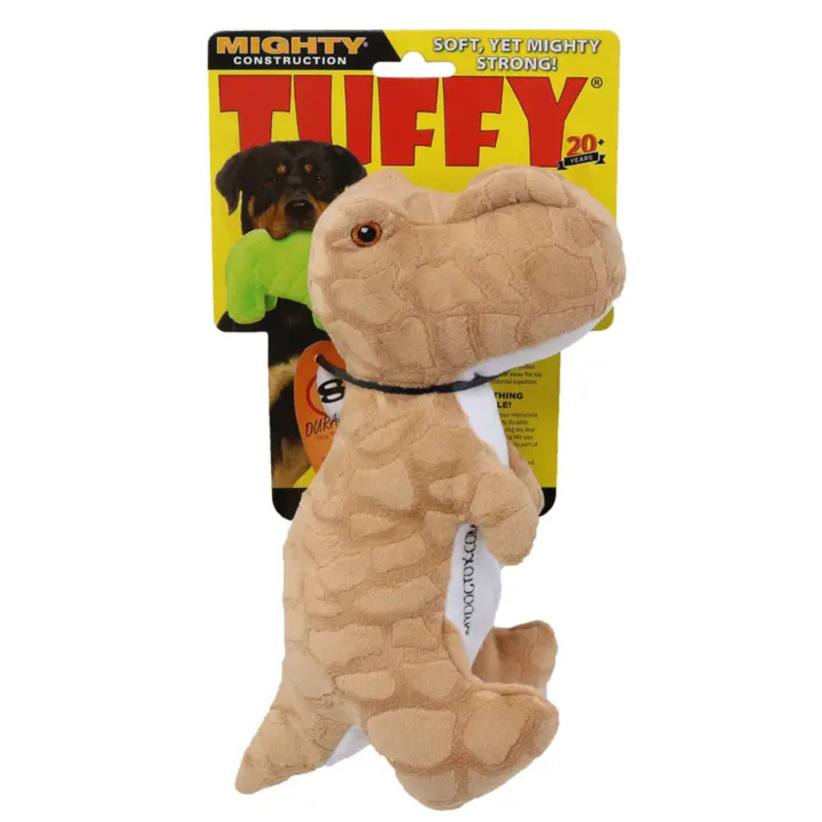A Tuffy dog toy shaped like a small dinosaur , made of tan textured plush fabric with a black collar, shown in front of its yellow and black retail packaging card.