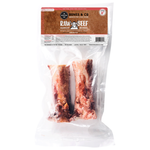 A package of Bones & Co. Raw Beef Bones, featuring two raw bone treats inside a clear plastic bag with a brown and white header label.